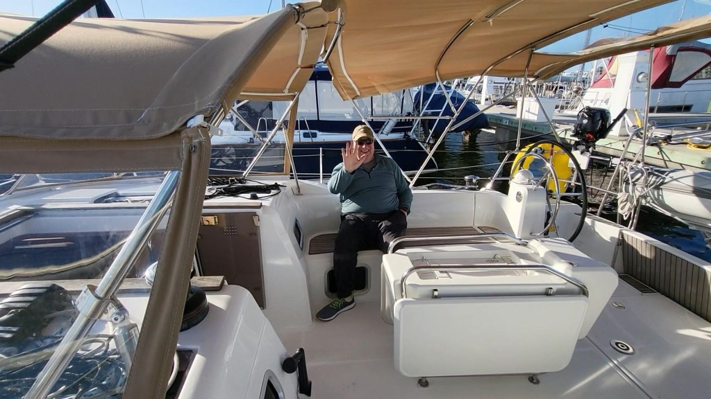 Picture of Kent sitting in the cockpit of the Breaking Away with a big smile on his face!