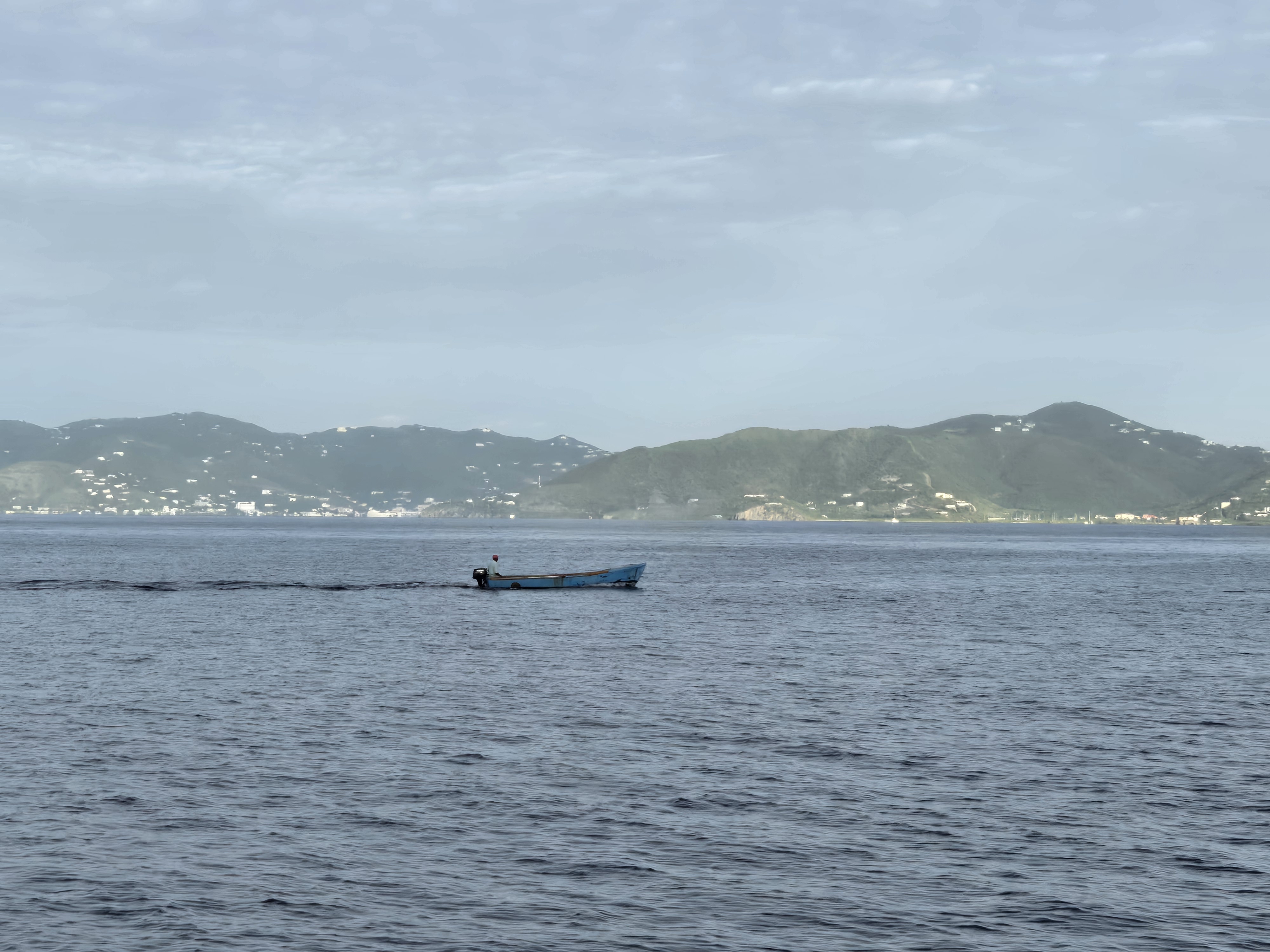 a small fishing boat on the ocean