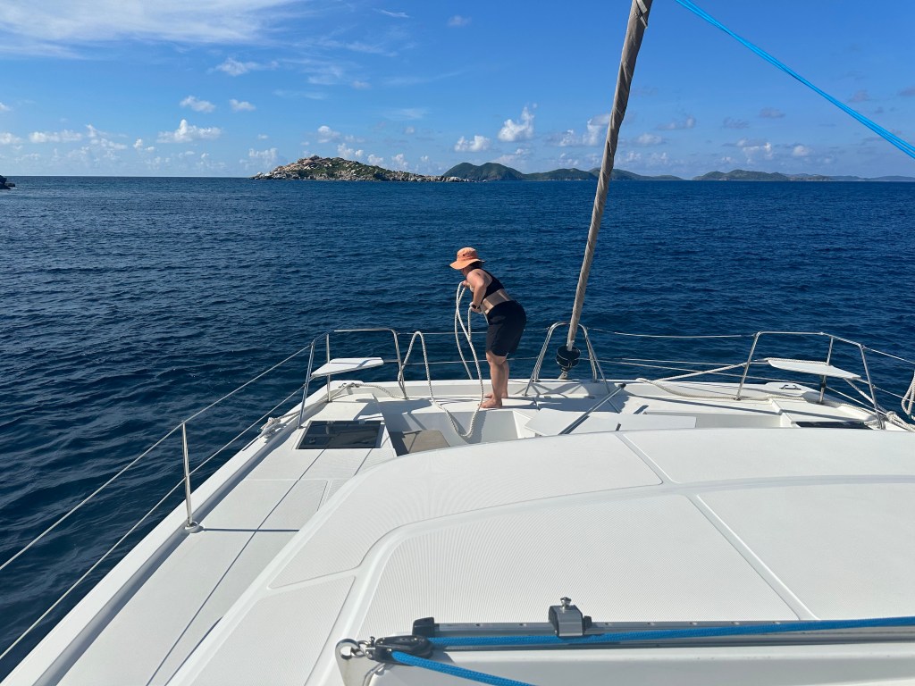 Becca handling the lines on the bow of the catamaran