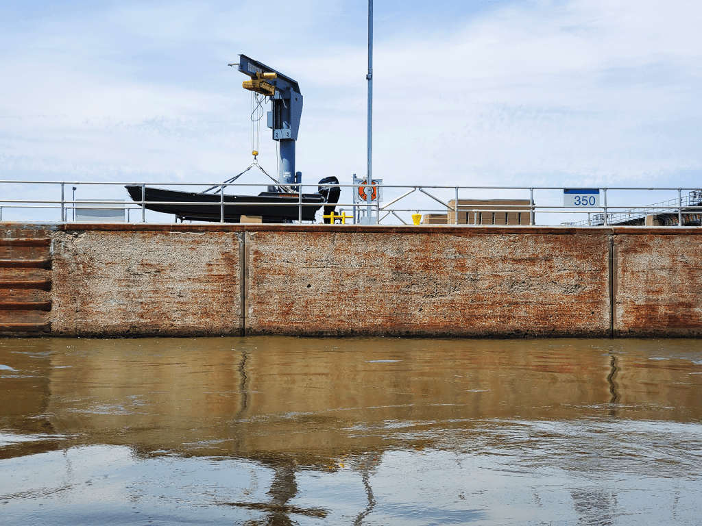 High water on the inside of a lock on a river