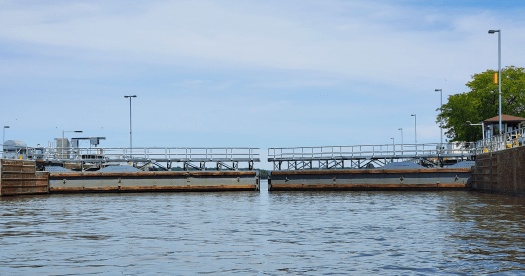 the enormous gates of a lock on the Mississippi River beginning to open