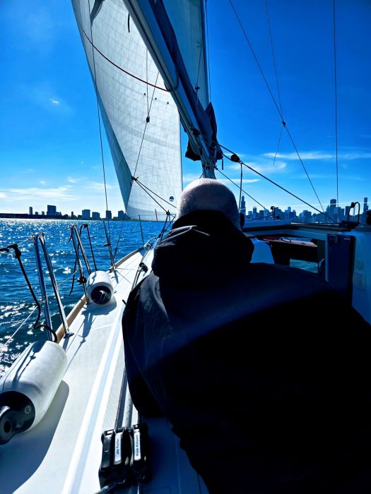 kent sitting the cockpit, enjoying the view of the Chicago skyline from Lake Michigan.