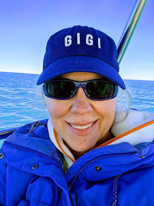 becca wearing sunglasses and her GiGi cap, big smiles.