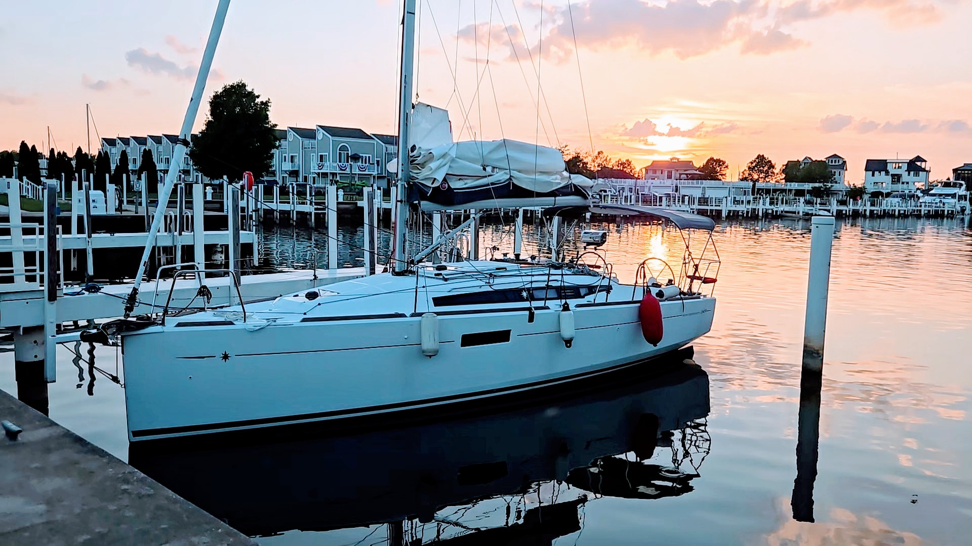 Red Sky on the dock in New Buffalo, sun setting in the background.