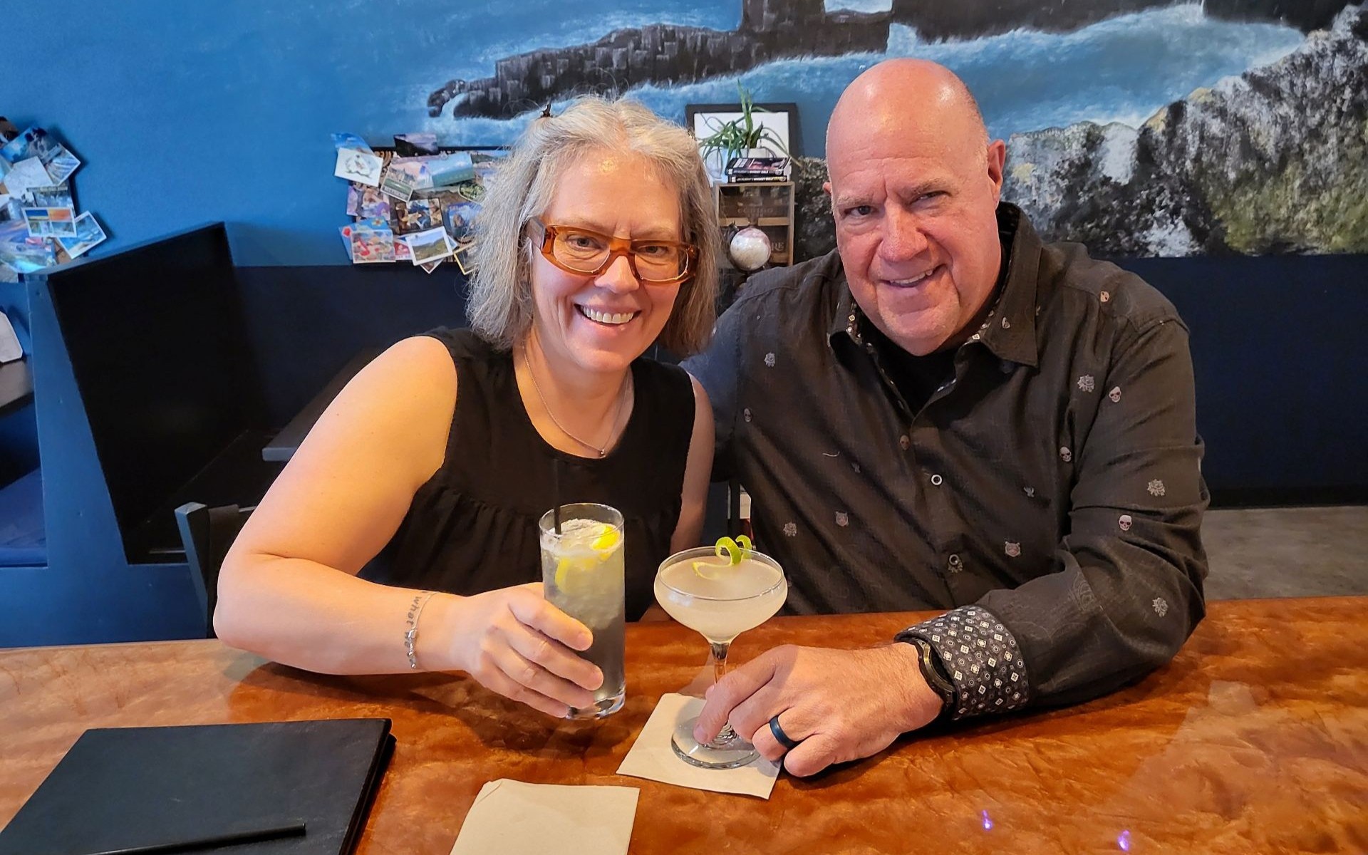 Kent and Becca celebrating over cocktails.