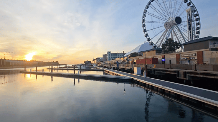 Sunrise on Lake Michigan from the dock in Navy Pier, the ferris wheel above us to the right.